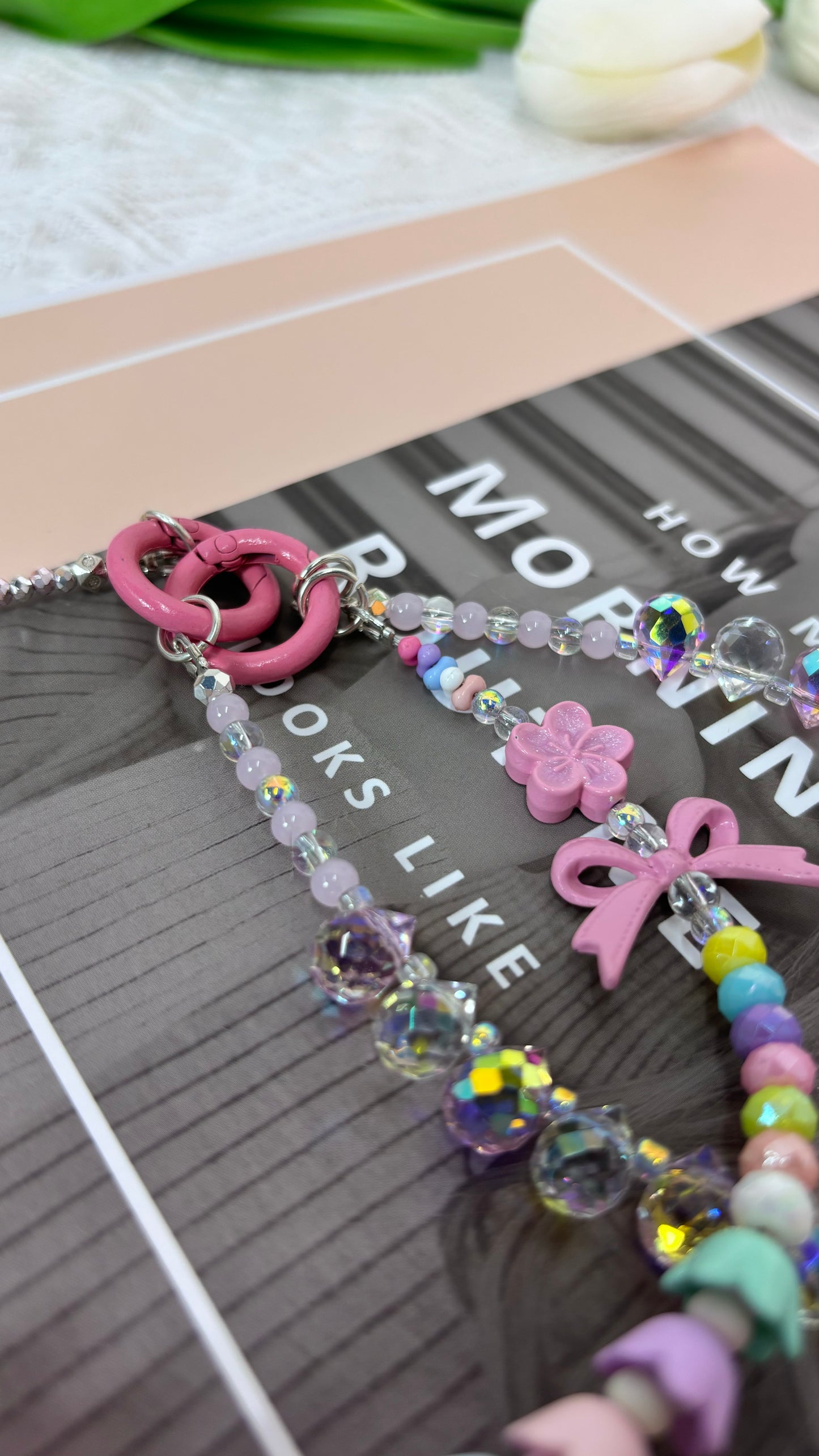 【CharmLink】Charming Pastel and Iridescent Beaded Phone Charm – Featuring Cute Flowers, Bows, and Colorful Beads for a Playful and Stylish Look